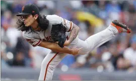  ?? DAVID ZALUBOWSKI — THE ASSOCIATED PRESS ?? Dereck Rodriguez started and worked five innings against the Rockies in Game 2, getting the win as the Giants swept Monday’s doublehead­er .