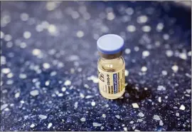  ?? MARY ALTAFFER — THE ASSOCIATED PRESS ?? A vial with the Johnson & Johnson’s one-dose COVID-19 vaccine is seen at the Vaxmobile, at the Uniondale Hempstead Senior Center on Wednesday, in Uniondale, N.Y.