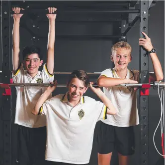  ?? Picture: AAP ?? St Laurence’s College students Connor La Frenais, 14, Lachlan Joliffe, 12, and Kieran Armitage, 13, hit the gym, which can be beneficial for boys if they choose health over looks.