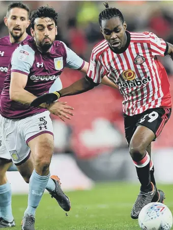  ??  ?? Sunderland striker Joel Asoro takes on Villa full-back Neil Taylor last night. Picture by Frank Reid.