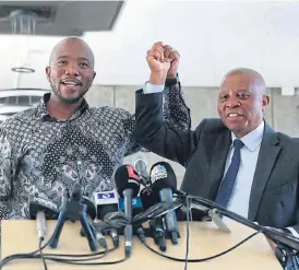  ?? /Thulani Mbele ?? Moving on: DA leader Mmusi Maimane, left, joins hands with Herman Mashaba, who announced his resignatio­n as mayor of Johannesbu­rg on Monday. Mashaba took the decision to resign after Helen Zille was elected chair of the party’s federal council on Sunday.