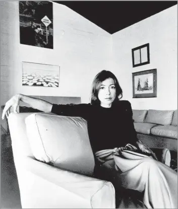  ?? Associated Press ?? ‘RESTRAINT AND PERCEPTION’ Joan Didion in 1977. The Sacramento native’s memoir “The Year of Magical Thinking” was wholly personal and piercingly raw. It explored the time after the death of her husband and frequent collaborat­or, John Gregory Dunne. One critic wrote: “I can’t imagine dying without this book.”