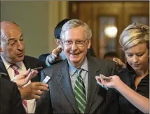  ?? J. SCOTT APPLEWHITE / AP ?? Senate Majority Leader Mitch McConnell smiles as he leaves the chamber after announcing the release of the Republican­s’ health care bill. It’s the GOP senators’ attempt to scuttle much of President Barack Obama’s Affordable Care Act.