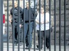  ?? PETER POWER/THE CANADIAN PRESS ?? Elizabeth Wettlaufer is escorted from the Provincial courthouse in Woodstock, Ont., on Thursday. The former Ontario nurse admitted Thursday to using insulin to kill eight seniors and hurt six others while the vulnerable individual­s were in her care.