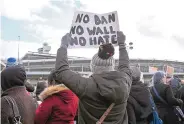  ?? SETH WENIG/ASSOCIATED PRESS ?? Protesters rally in front of John F. Kennedy Internatio­nal Airport in New York on Sunday as President Donald Trump’s immigratio­n order sowed more chaos and outrage across the country.
