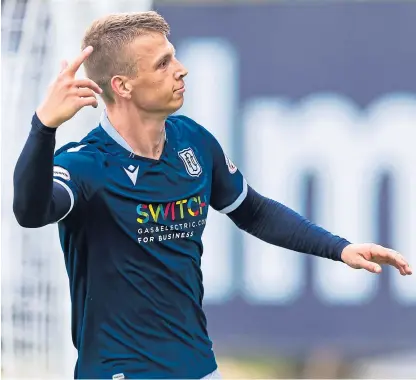  ??  ?? Andrew Nelson after scoring against Blackpool in a preseason friendly last year. Below: Josh Mulligan and Luke Strachan have come back from loan stints raring to go.