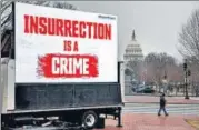  ?? BLOOMBERG ?? A truck flashing a digital sign that backs the attempt to convict Donald Trump, near the US Capitol in Washington, DC.