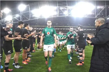  ?? — Reuters photo ?? New Zealand players form a guard of honour for Ireland’s Johnny Sexton and team mates after a match in this file photo.