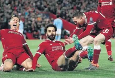  ?? REUTERS ?? Liverpool’s Mohamed Salah (centre) celebrates his goal with Roberto Firmino (left) and Andrew Robertson on Wednesday.