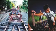  ?? AFP ?? ‘Trolley boy’ couple Tyson Aguha and Joan Acebo (left) sit on a train track waiting for passengers while a ‘trolley boy’ (right) pushes a home-made cart with passengers on a track.