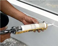  ??  ?? Save heat at home by using caulk to close gaps.