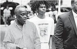  ?? STEPHEN B. MORTON/AP ?? Marcus Aubrey, left, makes his way back to court after a recess Thursday in Brunswick, Georgia, during a preliminar­y hearing for three men accused of killing his son, Ahmaud, 25.