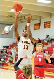  ?? STAFF PHOTO BY ROBIN RUDD ?? Tyner’s Keelan Patterson (13) shoots a jump shot.