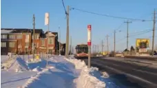  ?? JACK LAKEY ?? Westerly winds have blown snow from a field onto a sidewalk on the west side of Danforth Rd., north of Mack Ave., that had already been cleared.