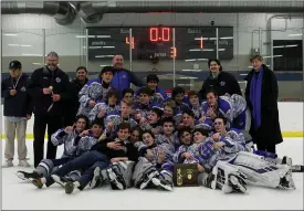  ?? DAVID C. TURBEN — FOR THE NEWS-HERALD ?? Gilmour poses with its trophy after a 4-1Kent District final victory over Mentor on March 6to earn its first state frozen four berth since 2011.