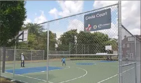  ?? Ashley Murray/Post-Gazette ?? Pittsburgh Mayor Bill Peduto and community leaders opened the Costa Court basketball court in Larimer with a ceremony Thursday.