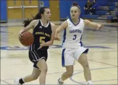  ?? STAN HUDY - THE SARATOGIAN ?? Averill Park’s Michelina Lombardi looks to race past Saratoga Springs’ Dolly Cairns in the first half of Friday’s Suburban Council match-up at Saratoga Springs High School.