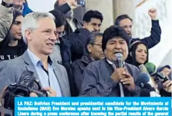  ??  ?? LA PAZ: Bolivian President and presidenti­al candidate for the Movimiento al Socialismo (MAS) Evo Morales speaks next to his Vice-President Alvaro Garcia Linera during a press conference after knowing the partial results of the general elections at Quemado presidenti­al palace. —AFP