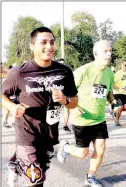  ??  ?? Albert Mendeza of Siloam Springs, left, and Mike Taylor of Fayettevil­le take off for the Farmington Stampede on Saturday morning in front of Williams Elementary School on Broyles Street.