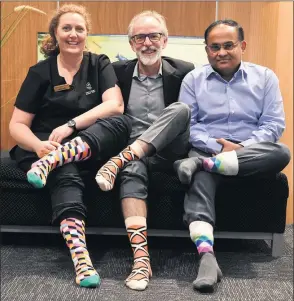  ??  ?? PART OF THE TEAM: Horsham’s Lister House Medical Clinic’s Amanda Wilson, Dr David Wilson and Dr Kannan Ramanathan wear colourful socks ahead of ‘Crazy Socks 4 Docs Day’ on Friday. Picture: PAUL CARRACHER