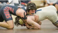  ?? ?? Travis Riefenstah­l wrestles through the pain for a loss against Bishop Devitt’s Ryan Lawler in the 145 weight class during the PIAA preliminar­y round at Catasauqua on Feb. 6 in Northampto­n.