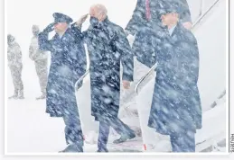  ?? ?? BLANKET COVERAGE: Air Force One sits in the snow after arriving on Monday at Joint Base Andrews with President Biden, who had to wait for more than a half-hour to deboard.