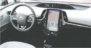  ?? BRIAN HARPER/DRIVING ?? The Prius Technology AWD-e’s touch screen can be distractin­g to use.