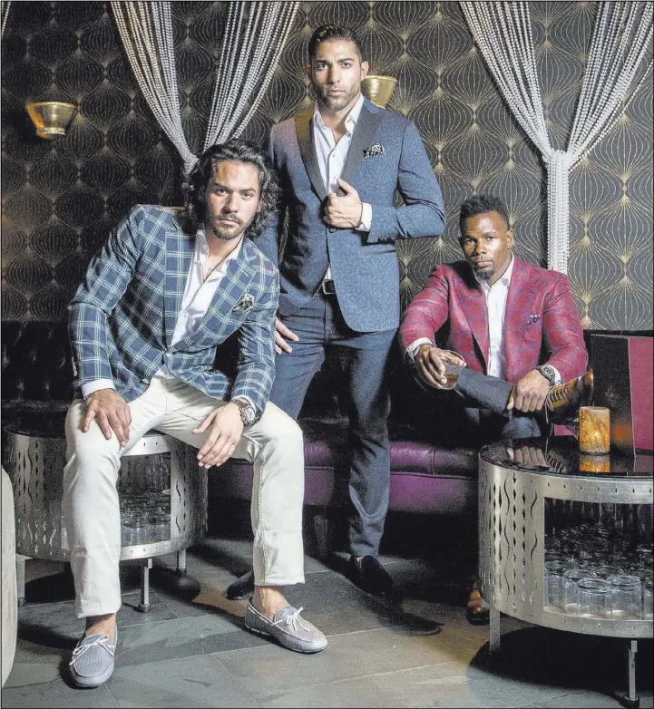 Jason Craig, from left, Brent Marks and Jai Shaun White model sport coats  from Stitched's XXXX Collection Black Label at Beauty and Essex for a  recent lookbook. Shane O'Neal.