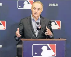  ?? AP PHOTO ?? Rob Manfred, commission­er of Major League Baseball, speaks during a news conference at the owners meetings Friday in Orlando, Fla.
