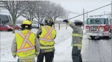  ?? DAVE JOHNSON
THE WELLAND TRIBUNE ?? Firefighte­rs cut a line down to re-open Kilally Street West after a transport truck clipped it between Oakwood Street and West Side Road.