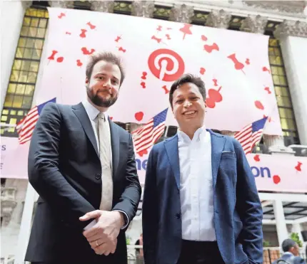  ?? RICHARD DREW/AP ?? Pinterest co-founder and chief product officer Evan Sharp, left, and fellow co-founder and CEO Ben Silbermann relish the moment outside the New York Stock Exchange on Thursday before the company’s IPO.