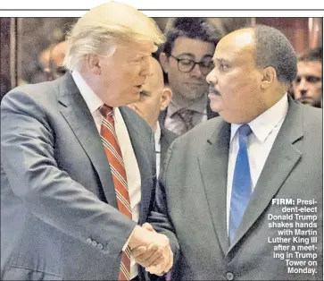  ??  ?? FIRM: President-elect Donald Trump shakes hands with Martin Luther King III after a meeting in Trump Tower on Monday.