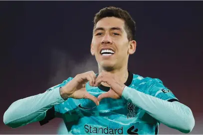  ?? Picture: AFP ?? STILL COUNTS. Liverpool’s Roberto Firmino celebrates after his shot was deflected into the net for a goal during their English Premier League match against Sheffield United at Bramall Lane on Sunday night.