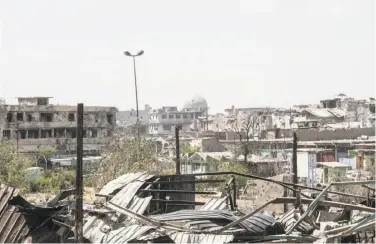  ?? Martyn Aim / Getty Images ?? Islamic State fighters reportedly blew up the al-Nouri mosque (dome in background) in Mosul.