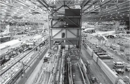  ?? JENNIFER BUCHANAN AP ?? Economists expect growth to resume later this year. Pictured: 777 and 787 factory lines at Boeing's Everett Production Facility.