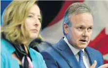  ?? JUSTIN TANG, THE CANADIAN PRESS ?? Senior deputy governor Carolyn Wilkins looks on Wednesday in Ottawa as Bank of Canada governor Stephen Poloz announces a quarter-point increase in the benchmark interest rate to 1.5 per cent.