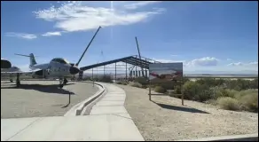  ?? PHOTO COURTESY OF THE FLIGHT TEST MUSEUM FOUNDATION ?? The skeleton of the first 60,000-square-foot hangar of the Flight Test Museum and Education Center stands behind the aircraft of the Century Circle, just outside Edwards Air Force Base’s West Gate. The museum will eventually house a world-class collection of aircraft.