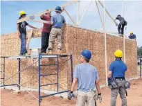  ?? CONTRIBUTE­D PHOTO ?? Crews work on the recent Habitat for Humanity build on Lennox Island.