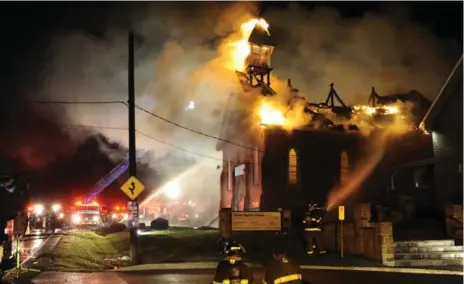  ?? GRAHAM PAINE/METROLAND ?? An overnight fire at Trinity Baptist Church on Appleby Line just north of #2 Side road has destroyed the old portion of the church.