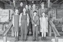  ?? The CW ?? Narrator Richard Thomas, middle top row, is flanked by the cast of “The Waltons: Homecoming.”