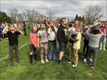  ?? PHOTO BY JEN SAMUEL FOR THE DAILY LOCAL NEWS ?? Students watch the eclipse on Monday at Upland Country Day School in East Marlboroug­h.