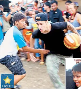  ??  ?? Pop star Justin Bieber kids around with children in City yesterday.