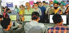  ?? AP ?? People stand in queue for a dose of vaccine at a vaccinatio­n centre in Mumbai on Thursday.