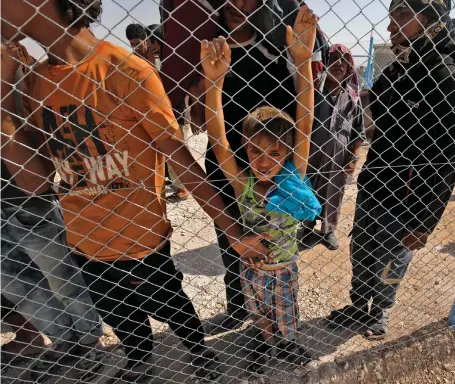  ?? AFP ?? Displaced Syrians on the Syria-Turkey border. The cost of reconstruc­ting the country has been estimated at over $200bn