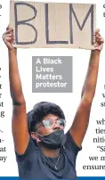  ??  ?? A Black Lives Matters protestor