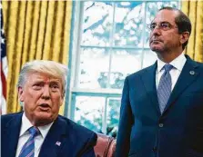  ?? Jabin Botsford / Washington Post file photo ?? Secretary of Health and Human Services Alex Azar listens to President Donald Trump during a signing ceremony in July 2019.