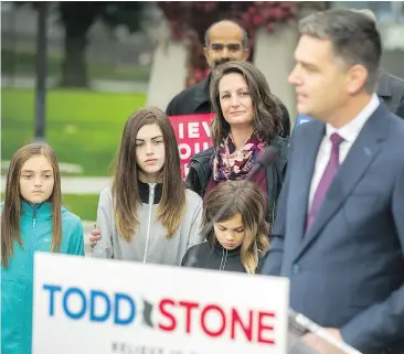  ?? ARLEN REDEKOP/PNG ?? Todd Stone’s wife Chantelle and their three children look on as Stone announces his bid for the B.C. Liberal leadership last week. If anything, Chantelle, a marketing profession­al, is considered even more ambitious than her husband.