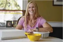  ?? JOSE F. MORENO/THE PHILADELPH­IA INQUIRER/TNS ?? Lisa Wolverton, a personal trainer from Ardmore, Pennsylvan­ia, still owns three pieces of Tupperware, including a yellow juicer she uses each day.