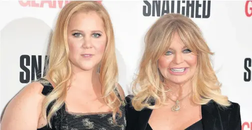  ??  ?? > Amy Schumer, left, and Goldie Hawn attending a screening of the film Snatched at the Soho Hotel in London yesterday