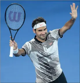  ?? Picture: JOE CASTRO, EPA ?? THANKS, FANS! Roger Federer waves to the crowd after his first-round win over Juergen Melzer of Austria at the Australian Open yesterday.